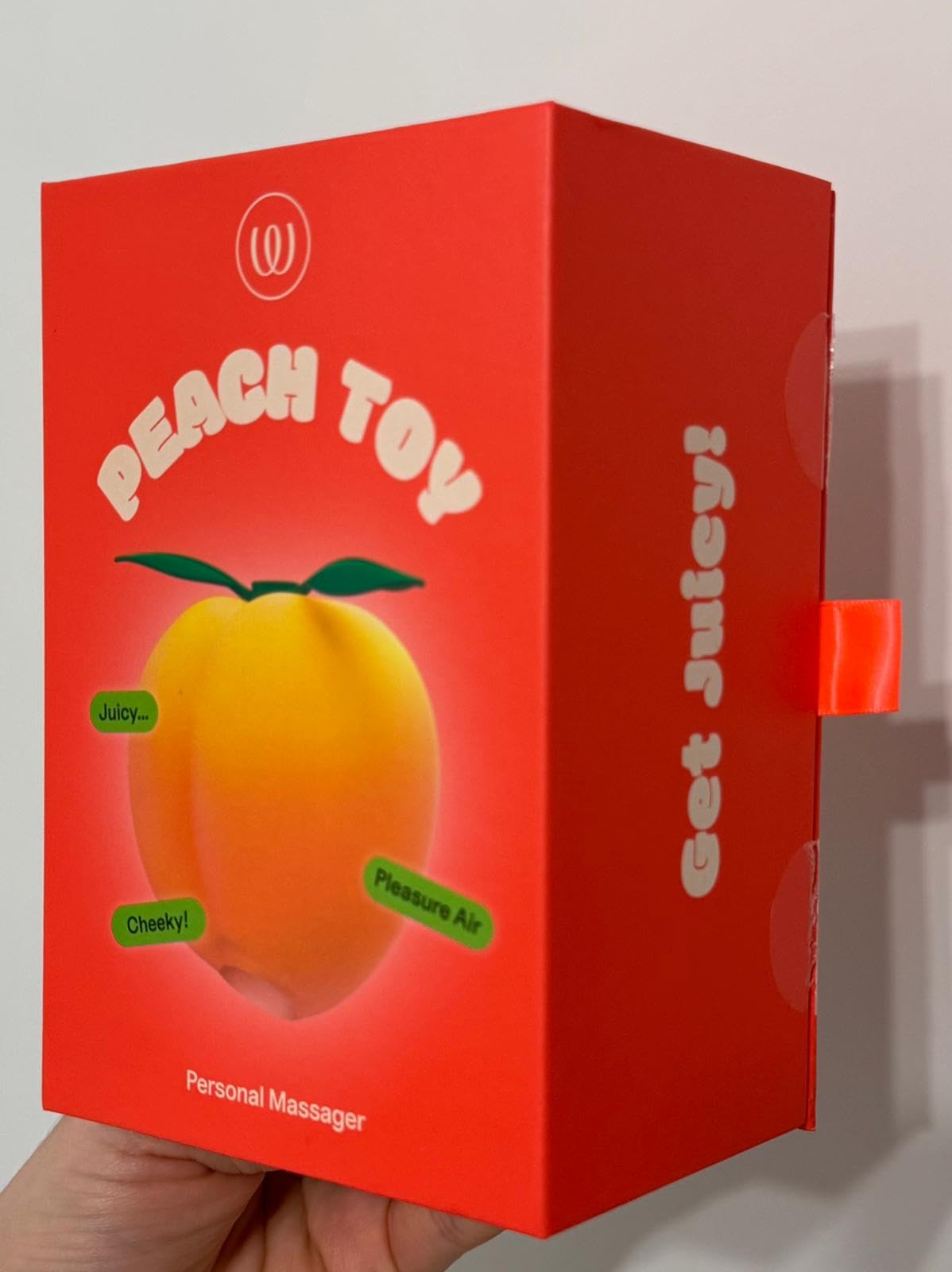 Womanizer Peach succhia clitoride 14 intensità impermeabile